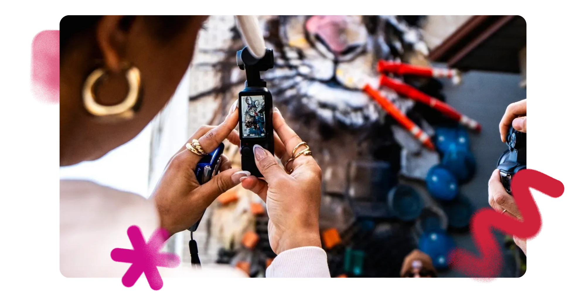 Person photographing a display with a smartphone, including a tiger image.